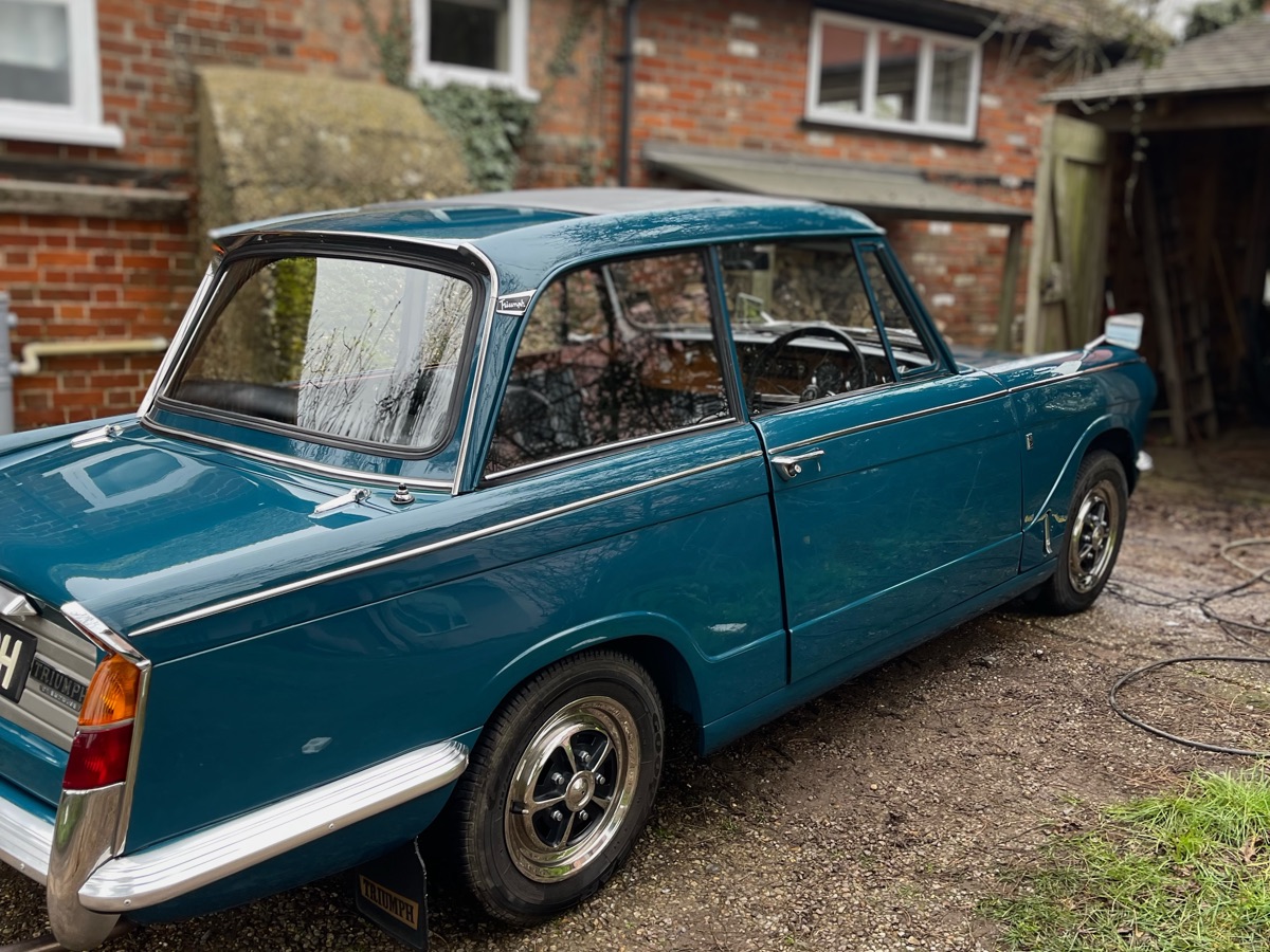 Blue classic Triumph exterior after a mobile wash