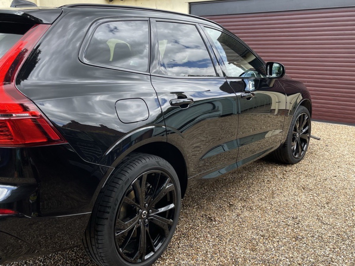 Clean black Volvo SUV rear quarter after a mobile wash